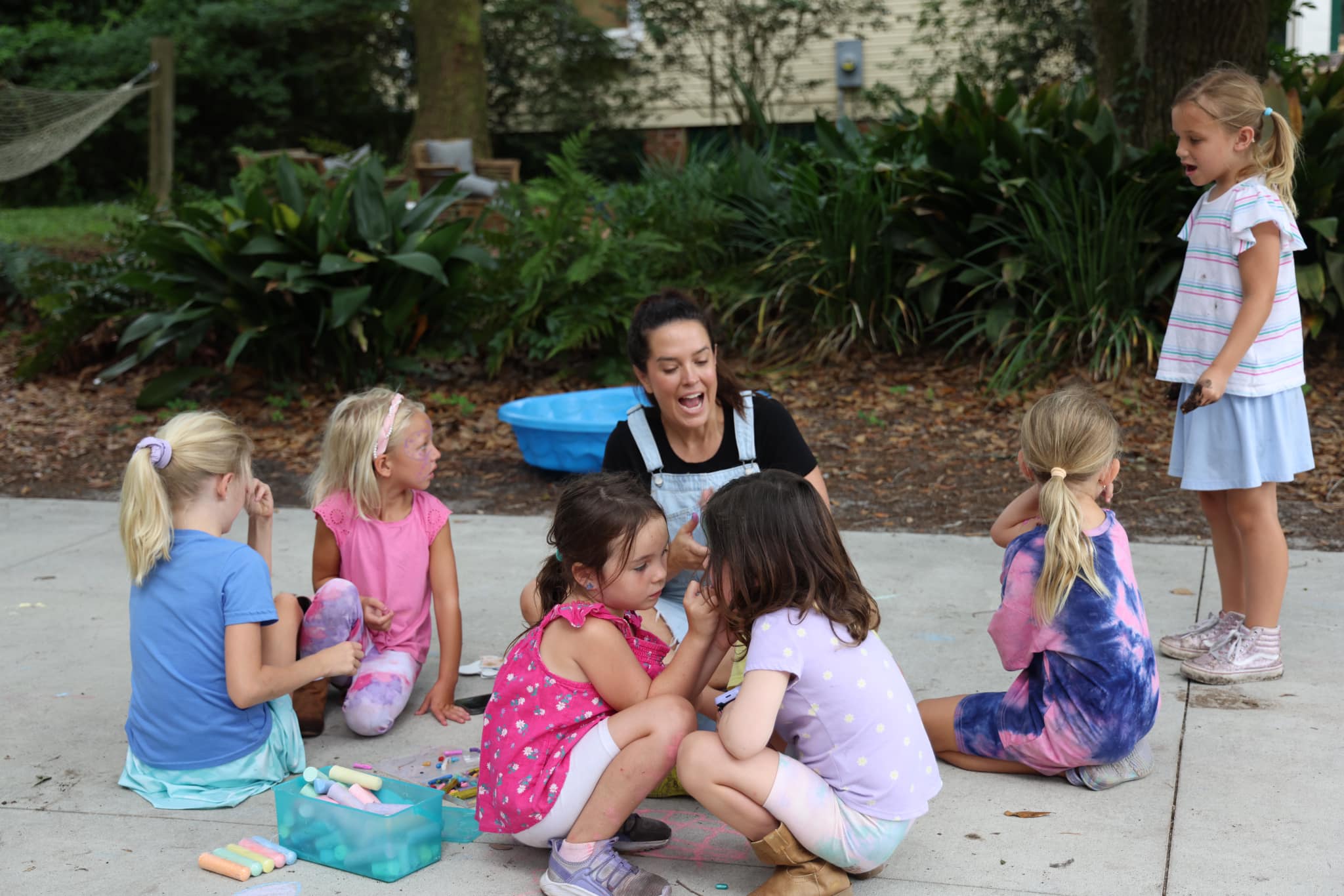 Katie doing chalk crafts with kids